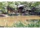 Charming lake house nestled among the trees, offering serene waterfront living at 121 Chattahoochee Circle, Locust Grove, GA 30248