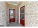 Welcoming front porch features double doors, brick walls, and elegant trim at 121 Chattahoochee Circle, Locust Grove, GA 30248