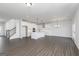 Open kitchen boasts a large island, modern appliances, and hardwood floors at 121 Chattahoochee Circle, Locust Grove, GA 30248