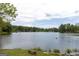 Scenic view of lake with clear water and green trees, ideal for outdoor activities at 121 Chattahoochee Circle, Locust Grove, GA 30248