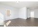 Spacious living room with hardwood floors, neutral walls, and a door to the outside at 121 Chattahoochee Circle, Locust Grove, GA 30248