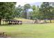 View of park area featuring picnic tables, playground and green space at 121 Chattahoochee Circle, Locust Grove, GA 30248