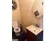 The bathroom features a sink with cabinet and a toilet with a modern mirror above the toilet at 268 Rountree Rd, Riverdale, GA 30274