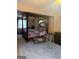 Primary bedroom with a four poster bed frame, large area rug, and natural light at 268 Rountree Rd, Riverdale, GA 30274