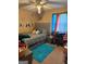Cozy bedroom with a bed, desk, and custom Paris-themed wall decor and blue rug at 268 Rountree Rd, Riverdale, GA 30274