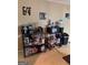 Functional kitchen area with microwave, water cooler, and storage racks for food and appliances at 268 Rountree Rd, Riverdale, GA 30274