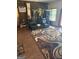 The living room features an accent wall, area rug, hard wood floors, exercise equipment, and natural lighting at 268 Rountree Rd, Riverdale, GA 30274