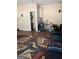 This living room features hard wood floors, area rug, 2 black recliners, and an entrance to the bathroom at 268 Rountree Rd, Riverdale, GA 30274