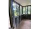 This is a view of the screened in patio with natural lighting and screens at 268 Rountree Rd, Riverdale, GA 30274
