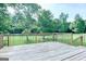 Relaxing backyard view from a wood planked deck with wood railings at 165 Mcelwaney Way, Fayetteville, GA 30215