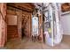Basement with concrete floors, stairs, hot water tank and HVAC unit at 165 Mcelwaney Way, Fayetteville, GA 30215