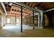 Unfinished basement with open ceiling, concrete floor, and exposed ductwork at 165 Mcelwaney Way, Fayetteville, GA 30215