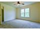 This bedroom features neutral walls and carpet, and large windows at 165 Mcelwaney Way, Fayetteville, GA 30215
