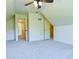 Slanted bedroom with ceiling fan, neutral walls and carpet, and closet space at 165 Mcelwaney Way, Fayetteville, GA 30215