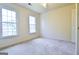 Bright bedroom with two windows and neutral carpet, offering a cozy and inviting space at 165 Mcelwaney Way, Fayetteville, GA 30215
