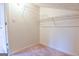 Walk-in closet with shelving and neutral carpet at 165 Mcelwaney Way, Fayetteville, GA 30215