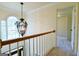 Hallway and carpeted stairway leading to a home's main floor at 165 Mcelwaney Way, Fayetteville, GA 30215