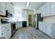 Beautiful kitchen featuring stainless steel appliances, white cabinets, and modern countertops at 165 Mcelwaney Way, Fayetteville, GA 30215