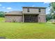 Expansive backyard featuring a screened-in porch ideal for outdoor entertaining at 132 Whitworth Dr # 15, Locust Grove, GA 30248