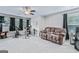 Finished basement area featuring a large sofa, exercise equipment, and ample space for recreation at 132 Whitworth Dr # 15, Locust Grove, GA 30248