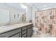 Bathroom with double vanity, tile floors, and a shower with decorative curtain at 132 Whitworth Dr # 15, Locust Grove, GA 30248