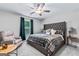 This bedroom offers plush carpet, ceiling fan, window, and comfortable seating at 132 Whitworth Dr # 15, Locust Grove, GA 30248