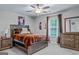 This bedroom boasts stylish decor, plush carpet, ceiling fan, and ample natural light at 132 Whitworth Dr # 15, Locust Grove, GA 30248