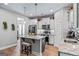 Modern kitchen featuring stainless steel appliances, an island with marble countertops, and light gray cabinets at 132 Whitworth Dr # 15, Locust Grove, GA 30248