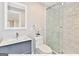 Modern bathroom with sleek vanity, marble tile shower, and decorative mirror at 4203 Harrogate Nw Dr, Atlanta, GA 30327