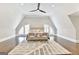Large main bedroom with arched windows, hardwood floors, an area rug, and two chairs at 4203 Harrogate Nw Dr, Atlanta, GA 30327