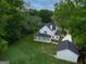 Aerial view of the home, featuring a large yard and convenient access to a detached garage at 61 Main St, Moreland, GA 30259