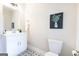 Bathroom with a white vanity, decorative painting, toilet, and decorative tile flooring at 61 Main St, Moreland, GA 30259