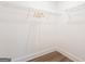 A tidy closet space with clean white walls, wire shelving, and wood-look floors at 61 Main St, Moreland, GA 30259