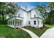 Beautiful two-story home with a welcoming covered porch and a professionally landscaped yard at 61 Main St, Moreland, GA 30259