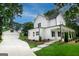Beautiful two-story home with a charming front porch and a detached two-car garage at 61 Main St, Moreland, GA 30259