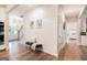 Inviting foyer with shiplap accent wall, stylish bench seating, and views to the dining and bedroom at 61 Main St, Moreland, GA 30259