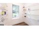 Well-organized pantry with wire shelving and a window for natural light at 61 Main St, Moreland, GA 30259