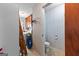 View into a half bath and utility area with vintage cabinetry and linoleum flooring at 75 Antioch Rd, Mcdonough, GA 30252