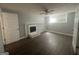 Finished basement features a cozy fireplace and a ceiling fan for added comfort at 8427 Fredericksburg Ct, Jonesboro, GA 30238