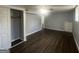 Basement bedroom featuring wood flooring, closet space, and a ceiling fan at 8427 Fredericksburg Ct, Jonesboro, GA 30238