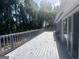 Spacious deck area with gray wood flooring and railing perfect for entertaining at 8427 Fredericksburg Ct, Jonesboro, GA 30238
