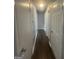 Hallway featuring new floors and access to various rooms at 8427 Fredericksburg Ct, Jonesboro, GA 30238