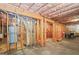 Unfinished basement featuring exposed ductwork, plumbing, and wooden framing at 3688 Eagles Beek Cir, Lithonia, GA 30038