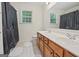 Bathroom featuring double sink vanity, a separate toilet, and shower-tub combo at 3688 Eagles Beek Cir, Lithonia, GA 30038