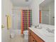 Well-lit bathroom featuring single sink vanity and shower-tub combo with colorful shower curtain at 3688 Eagles Beek Cir, Lithonia, GA 30038