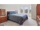 Spacious bedroom featuring large windows, a window seat, and neutral carpeting at 3688 Eagles Beek Cir, Lithonia, GA 30038