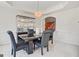 Dining room with black table and display case with a view of staircase at 3688 Eagles Beek Cir, Lithonia, GA 30038