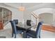 Dining room with black table, chandelier, and view of staircase at 3688 Eagles Beek Cir, Lithonia, GA 30038