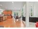 Open floor plan view of the living room connected to the kitchen and dining area at 3688 Eagles Beek Cir, Lithonia, GA 30038