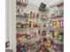 Walk-in pantry with wire shelving, fully stocked with a variety of groceries and household items at 3688 Eagles Beek Cir, Lithonia, GA 30038
